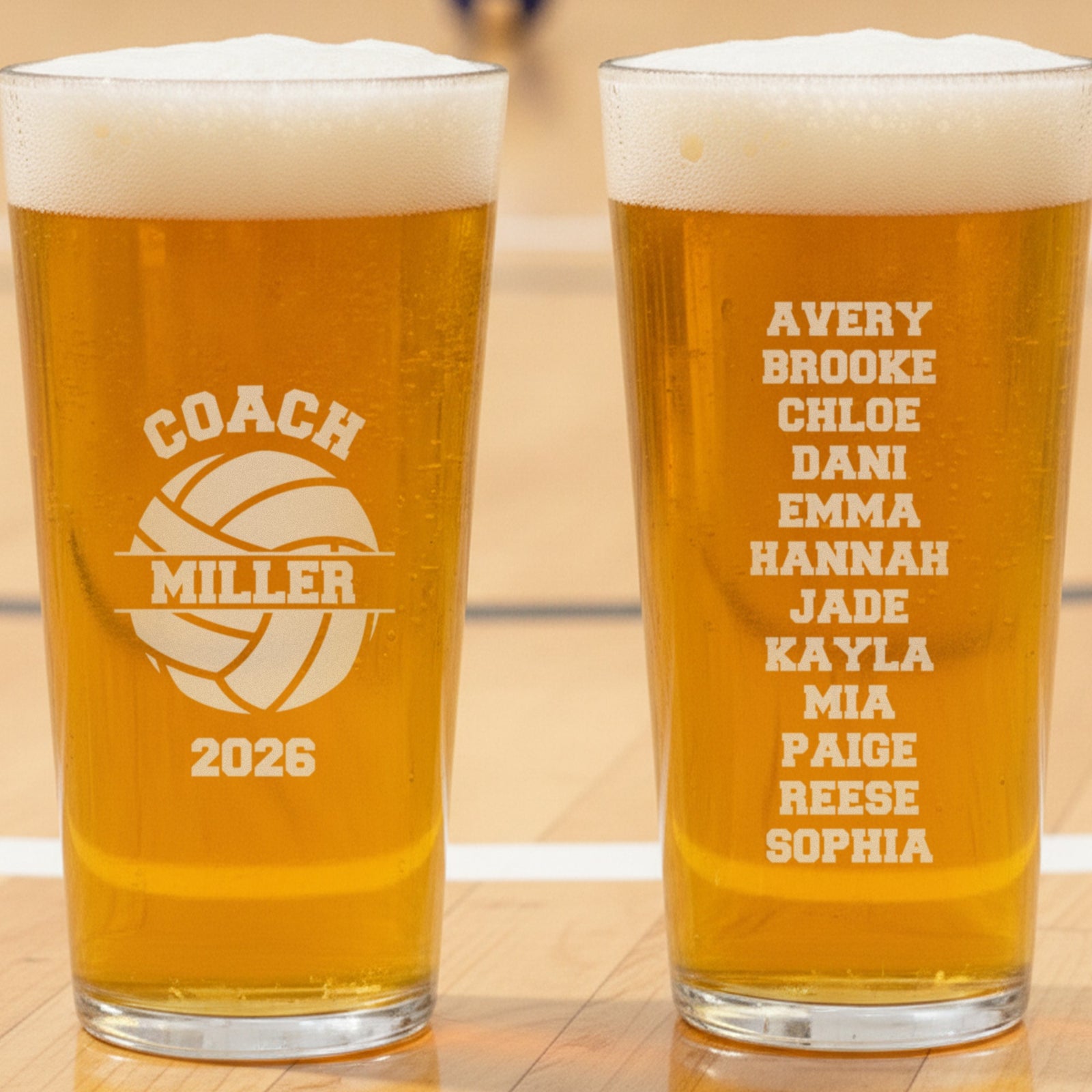 Personalized volleyball coach pint glass front engraved Coach Miller 2026 on a split volleyball, beside the back engraved with the team roster