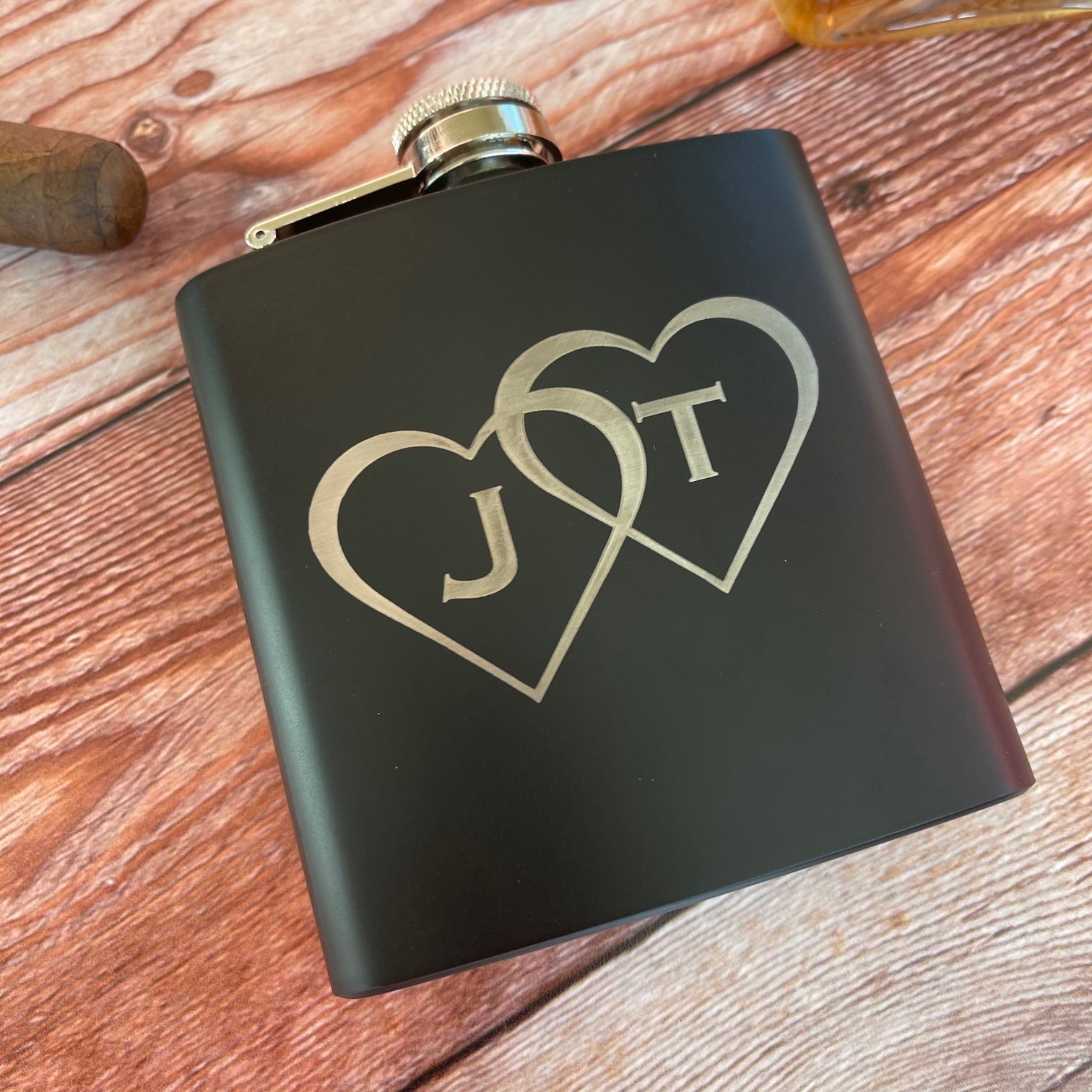 black flask with hearts and initials