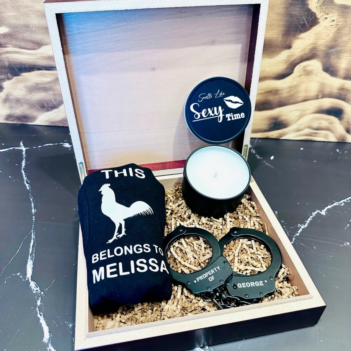Personalized Sexy Gift Set featuring a custom cedar-lined wooden box, engraved handcuffs, personalized boxers, and a pine-scented candle – perfect for Valentine’s Day, anniversaries, or romantic occasions.