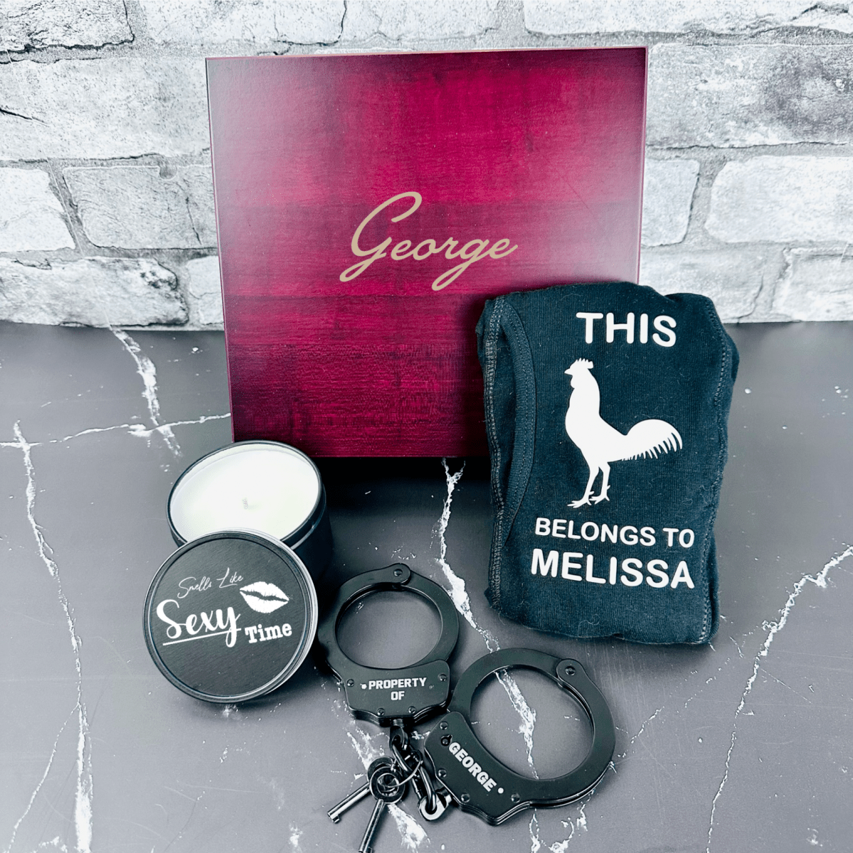 Personalized Sexy Gift Set featuring a custom cedar-lined wooden box, engraved handcuffs, personalized boxers, and a pine-scented candle – perfect for Valentine’s Day, anniversaries, or romantic occasions.