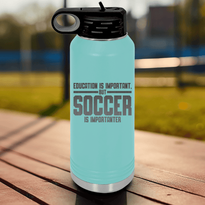Teal Soccer Water Bottle With Soccer Is Most Important Design