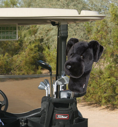 Dog head cover on golf clubs