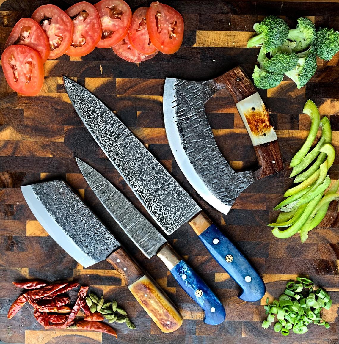 premium chef knife set for men with Damascus blades on cutting board