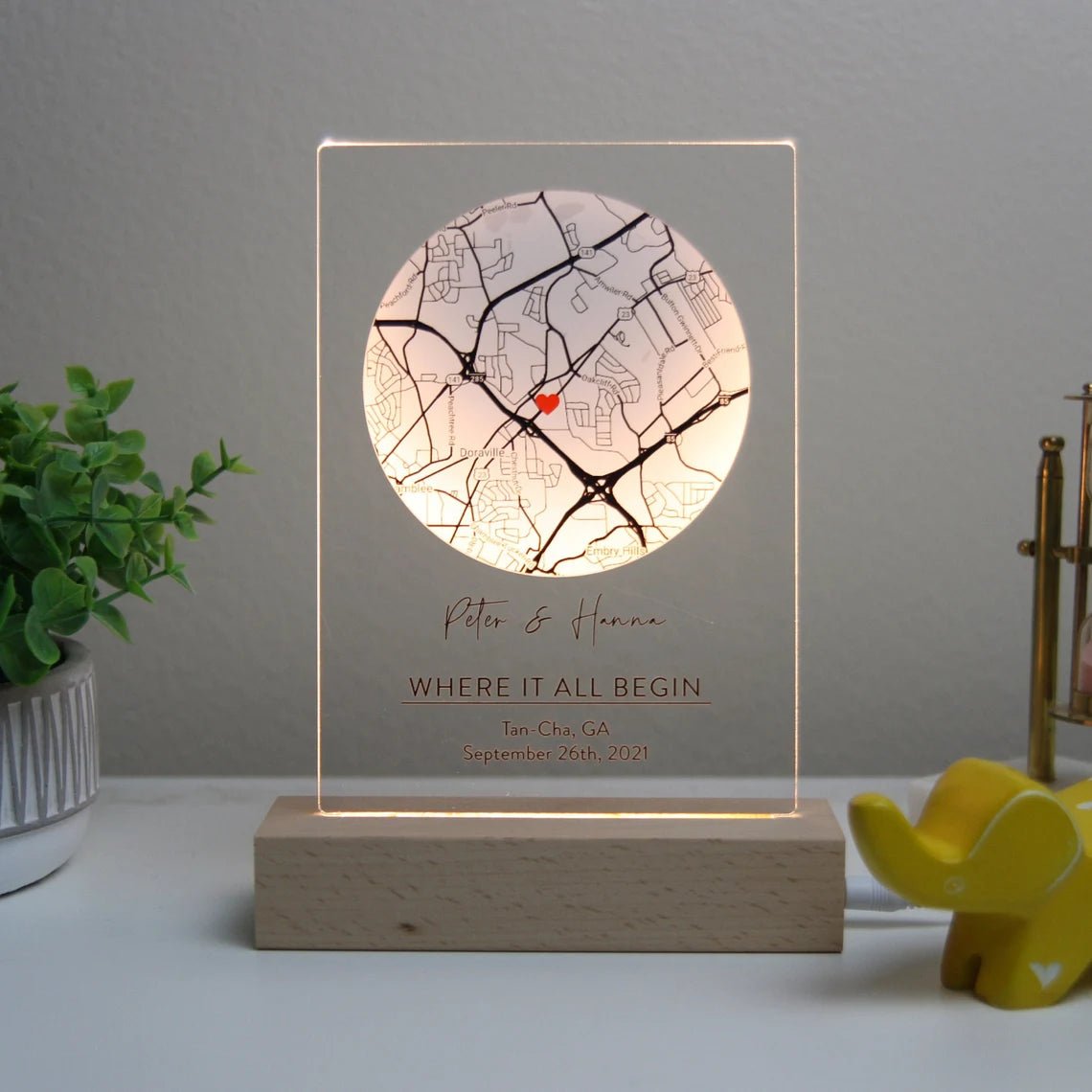 Romantic map sign personalized with custom coordinates, names, and date, available in wood or acrylic with optional LED light stand – perfect for Valentine’s Day, anniversaries, or weddings