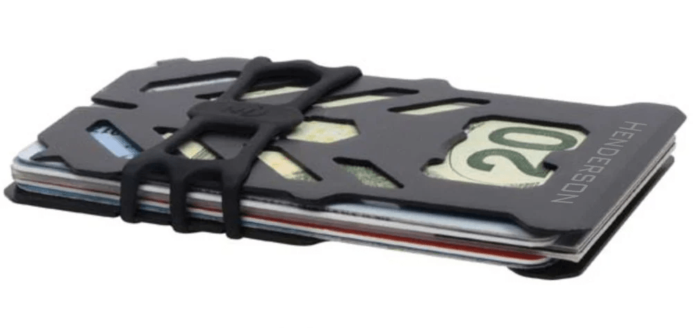 Black multi tool wallet seen from the side with HENDERSON engraved across the end of the top plate, cards and a 20 dollar bill tucked under its black strap