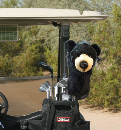 Bear head cover on golf clubs