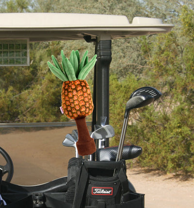 Pineapple head cover on golf clubs